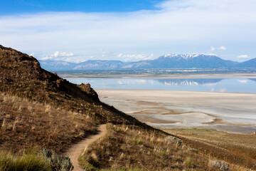 Farmington bay  in 2016 as seen from Antelope island with Wasatch mountain front reflected in water...