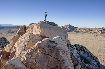 Woman On A Rocky Mountain Top