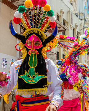 Dancer dressed as folk character called Diablo Huma (Devil)  on  carnival parade in Cuenca. Ecuador