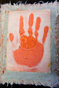 Freshly made paper with a watermark and hand print drying at the historic Paper Mill in Duszniki-Zdroj, Poland.