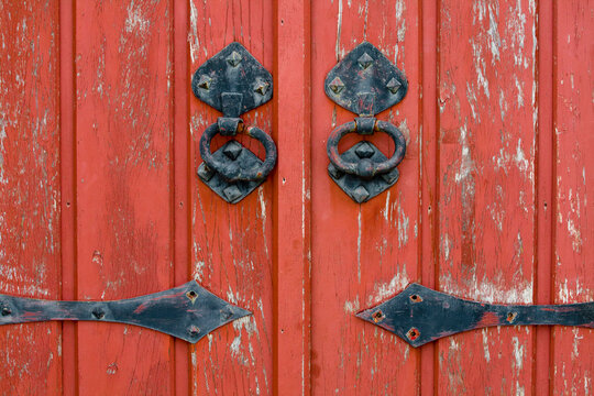 Red door with old metal knobs, Monsaraz, Alentejo, Portugal