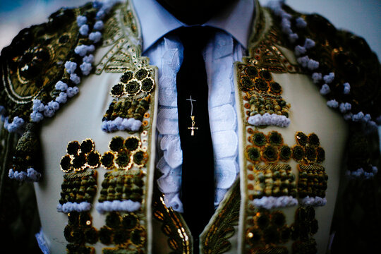 A cross representing good luck sewn into the tie of a matador, Plaza Monumental, Tijuana, Mexico.