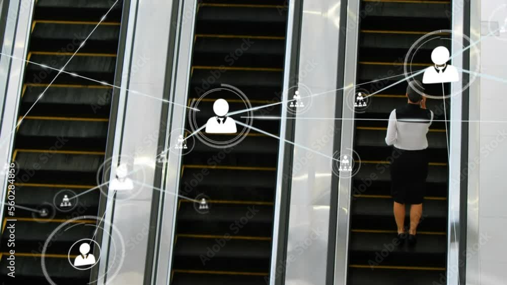 Sticker Animation of network of profile icons over rear view of businesswoman on escalator at modern office