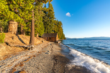 Sugar Pine Beach Park in South Lake Tahoe, California with Piers, Blue Lake, Sand, Water, Greenery and room for text.