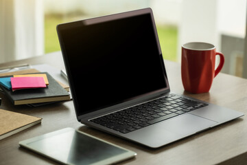 Laptop with blank screen on table. Workspace background new project on laptop computer with blank copy space screen for your advertising text message