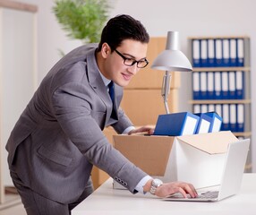 Businessman moving offices after promotion