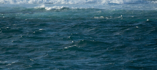 Choppy ocean waves background. Blue water banner. 