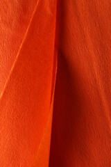 Orange textured material as background, closeup view