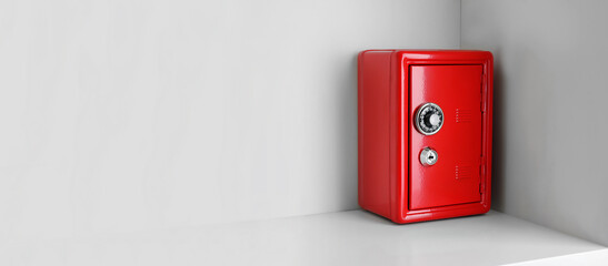 Red steel safe with mechanical combination lock on shelf, space for text. Banner design - obrazy, fototapety, plakaty