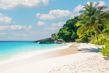 Beautiful tropical beach sea ocean with white cloud and blue sky background for travel vacation trip