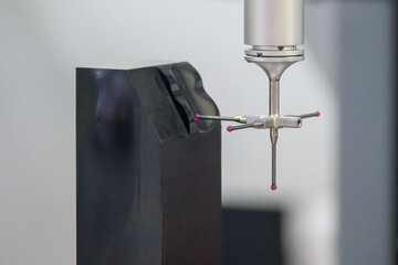 The  CMM machine measuring the graphite electrode parts by modular touching probe.