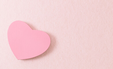 One heart gift box on a pink background.