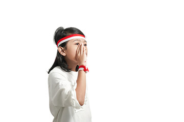 Asian girl with indonesian independence concept whispering something giving announcement. Isolated by white background.