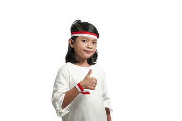 Asian girl child indonesian independence concept, giving approval sign with thumbs up. Isolated by white background.