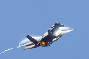 Very unusual close view of a F-35A Lightning II in a high G maneuver , with condensation clouds...