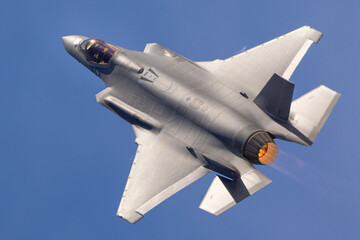 Unusual extremely close top view of a F-35A Lightning II  with afterburner on
