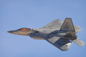 Close side view of a F-22 Raptor in beautiful light