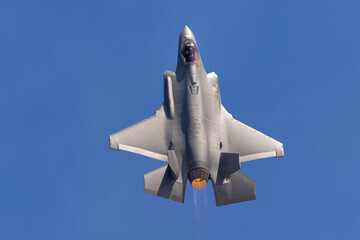 Unusual extremely close top view of a F-35A Lightning II  with afterburner on