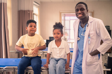 Doctor playing with his patient in hospital. Pediatrician and kid