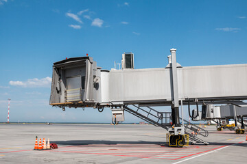 Empty passenger jet bridges at airport apron