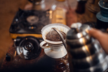 Closeup of hands barista make coffee