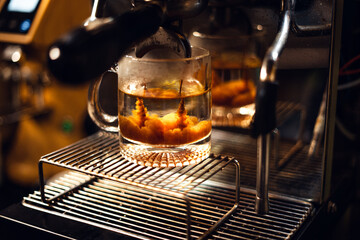Preparing hot Coffee Americano with a Coffee Machine