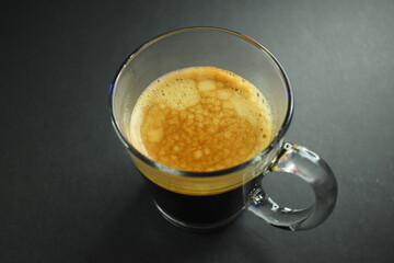 hot black coffee on black table, beverage in the morning