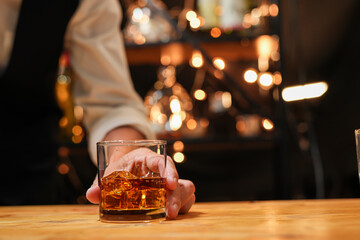 Bartender pouring Whiskey, on  bar