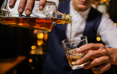 Bartender pouring Whiskey, on  bar,