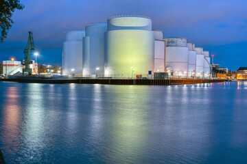 Storage tanks for crude oil at night seen in Berlin