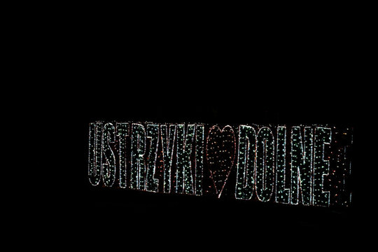 Ustrzyki Dolne, Subcarpathian, Poland - January 10, 2023: Illuminated inscription with the name of the city of Ustrzyki Dolne in Poland.