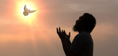 Doves fly in the sky. Christians have faith in Holy Spirit. silhouette worship to god with love...