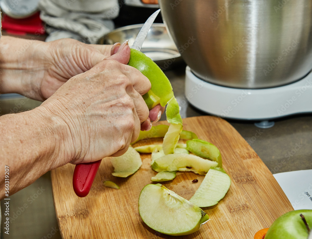 Poster Chef cuts apples to make an apple pie. Step by step recipe