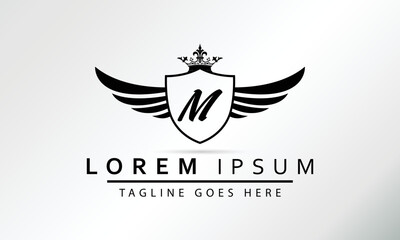 Obraz premium Stylish Black Shield With Wings, Crown And Initial Letter M Isolated On White Background. Luxury Logo Business Vector Template. Modern Design Logotype, Emblem,