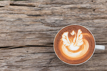 Top view mocha of coffee with chocolate on a wooden table background.
