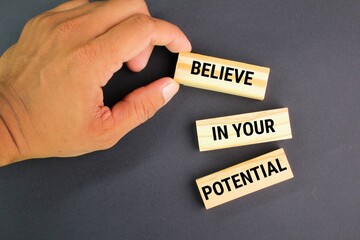 wooden board with the words Believe in your potential. the concept of self-confidence. the concept...