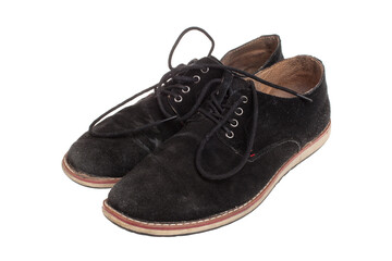 Pair of old black male shoes isolated on white