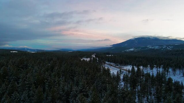 Winter's Majestic Scene: A Sunset View of Snowcapped Mountains in British Columbia