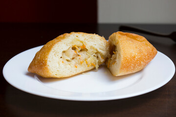 Pirozhki​ are stuffed rolls typical of Russian, Belarusian, and Ukrainian cuisines. They can be baked or fried with yeast. Their fillings are made of meat or vegetables.