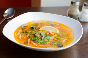 Solyanka is a traditional Russian soup made with meat, fish, or mushrooms, and vegetables such as tomatoes, onions, olives, and cabbage.