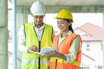 Builder inspection consultancy. Two engineer consulting and checking material and structure in construction.