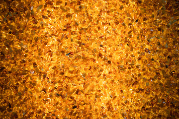 Natural amber mosaic, close-up background photo texture