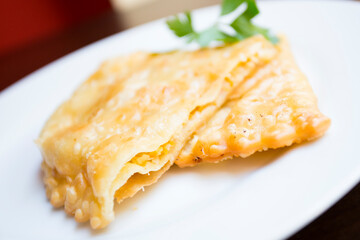 A blini, or sometimes blin, is a Russian and more broadly Eastern European pancake that is traditionally made from buckwheat or wheat flour today and served with smetana, tvorog, butter, caviar, ...