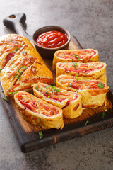 Stromboli Pizza homemade dough loaded with meats, sauce and cheese and rolled up and baked closeup...