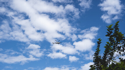 helicopter andclouds in the sky