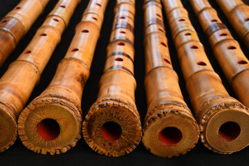 Shakuhachi flute, Shakuhachi is Japanese bamboo flute, on black background.