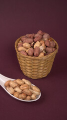 Close up of Salted Peanuts Indian namkeen (snacks) on a ceramic white bowl. Top view