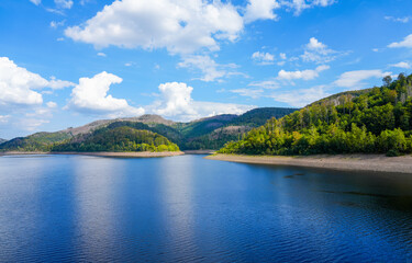 Naklejka premium Nature at the Odertalsperre in the Harz Mountains, near Bad Lauterberg. View of the Oder reservoir with the surrounding landscape. 