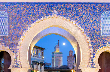 Bab Bou Jeloud gate (The Blue Gate) located at Fez, Morocco at sunset - obrazy, fototapety, plakaty