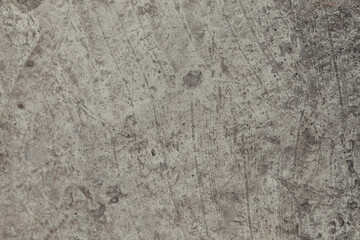 A concrete wall texture with cracks and scratches. Abstract background, old cement wall.